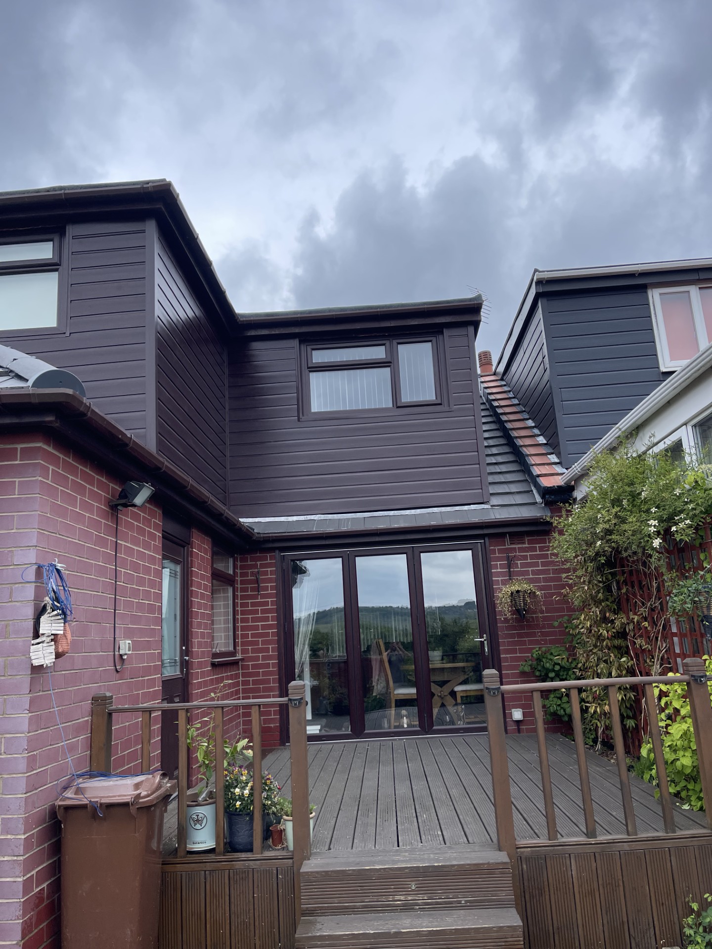 Exterior cladding, bi-fold doors and decking